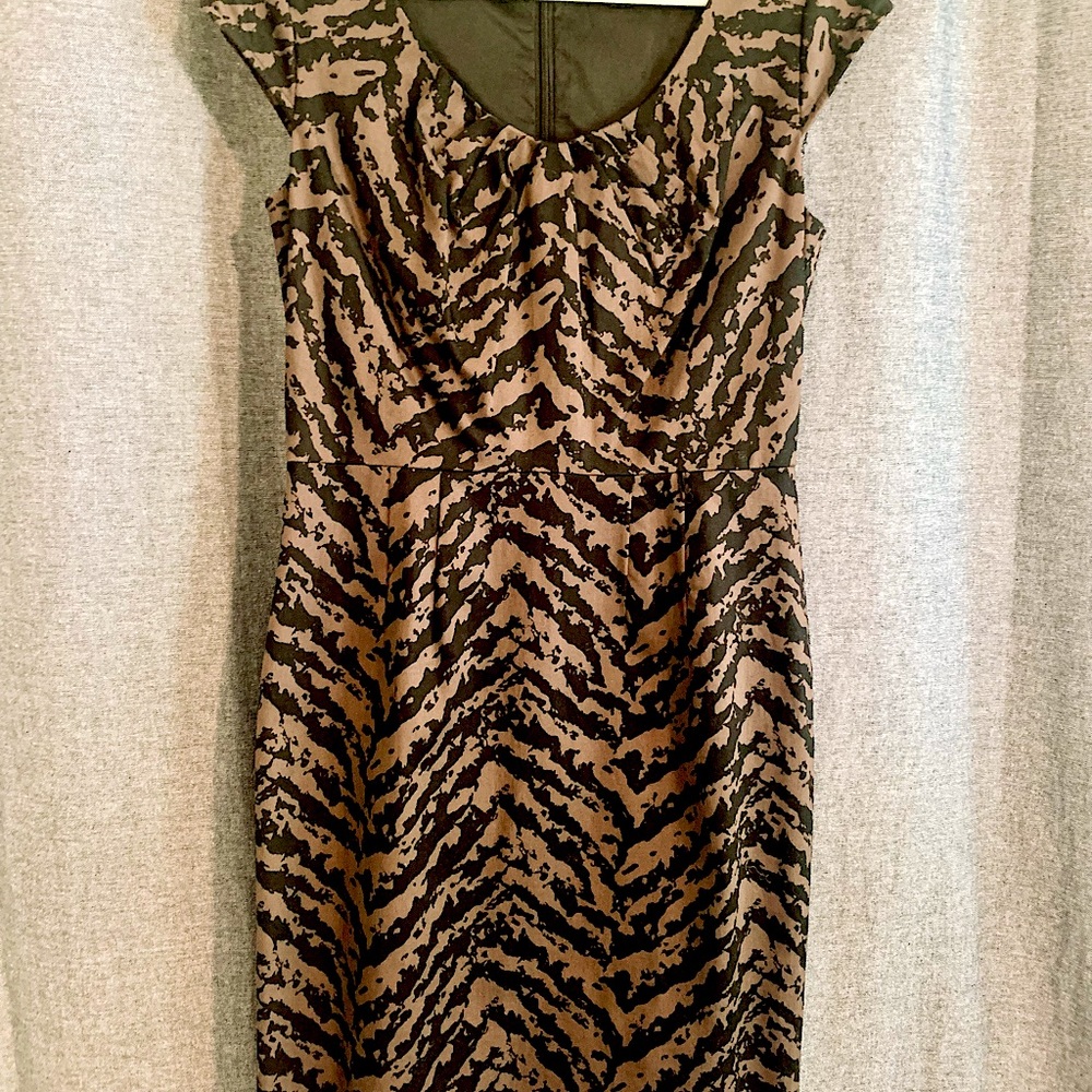 Cap sleeve dress; feminine neckline silhouette.